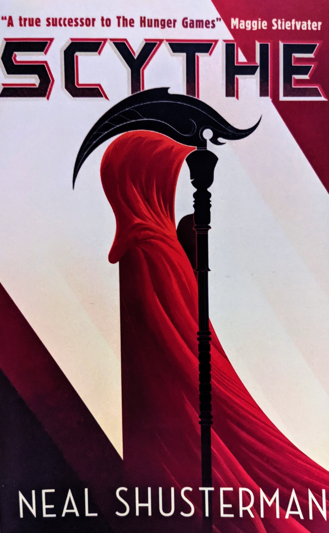 Scythe cover, showcasing a figure in a red cloak holding a scythe